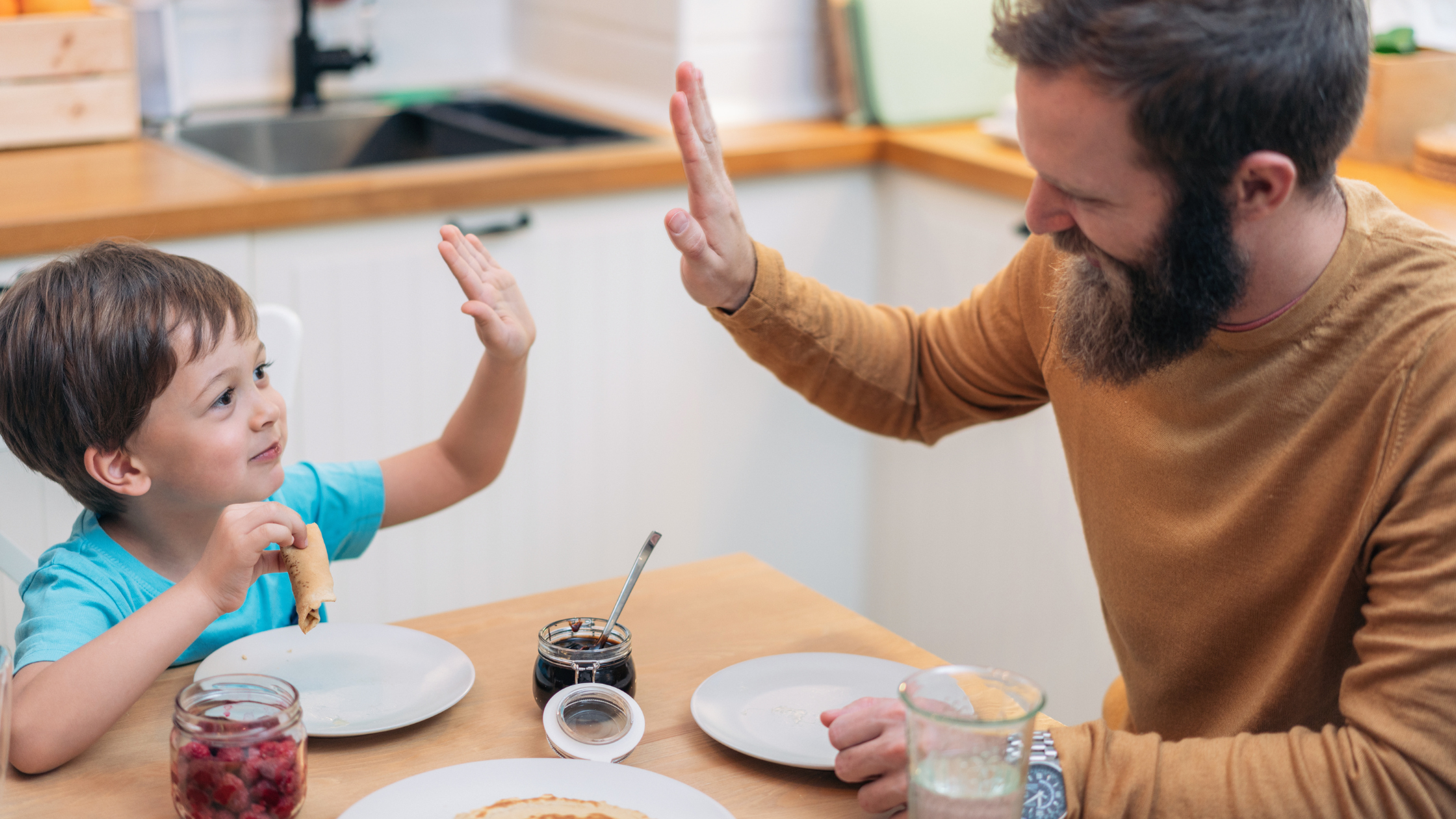 Father and Son High Fiving